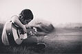 very young boy with an acoustic guitar